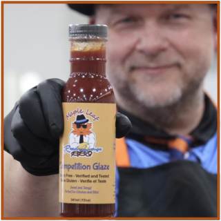 Chef and Bottle of Sugar Free BBQ Sauce made in Alberta