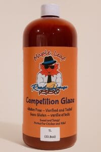 Large 1L bottle of Maple Leaf Roadhouse BBQ Competition Glaze with orange label and maple leaf logo.